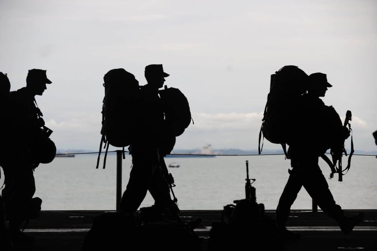 United States soldiers walking in line.