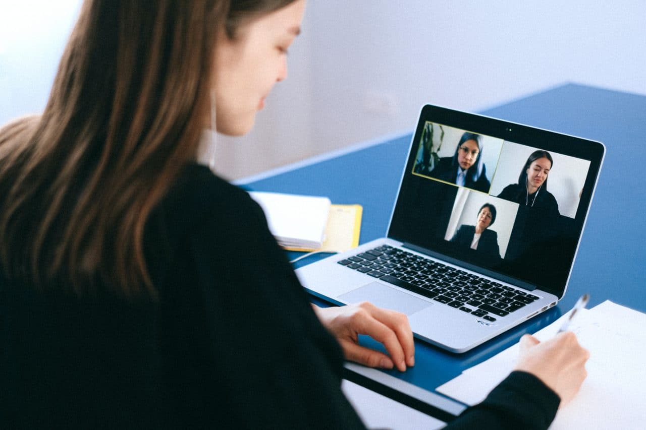 Woman in a virtual work meeting.